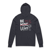 navy featherweight hoodie with the phrase "Be Mine". Mine is crossed out and Wine is written underneath. minimalist wine glass and heart graphics complete the design