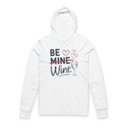 white  featherweight hoodie with the phrase "Be Mine". Mine is crossed out and Wine is written underneath. minimalist wine glass and heart graphics complete the design