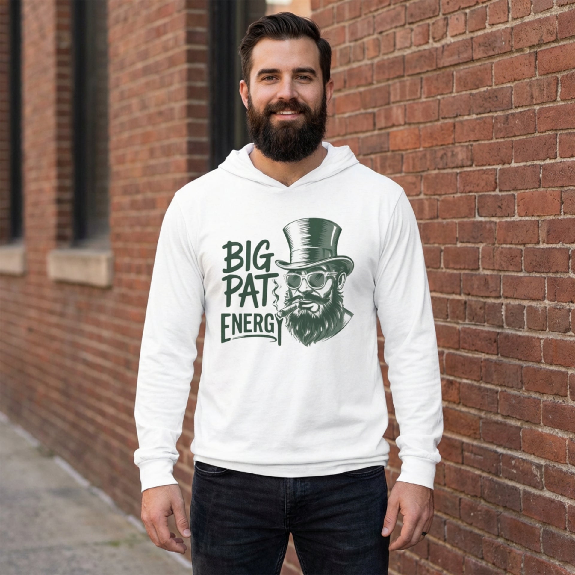brunette male model wearing a white  lightweight St Patricks  Day hoodie with the Phrase “Big Pat Energy”  with a leprechaun smoking a cigar
