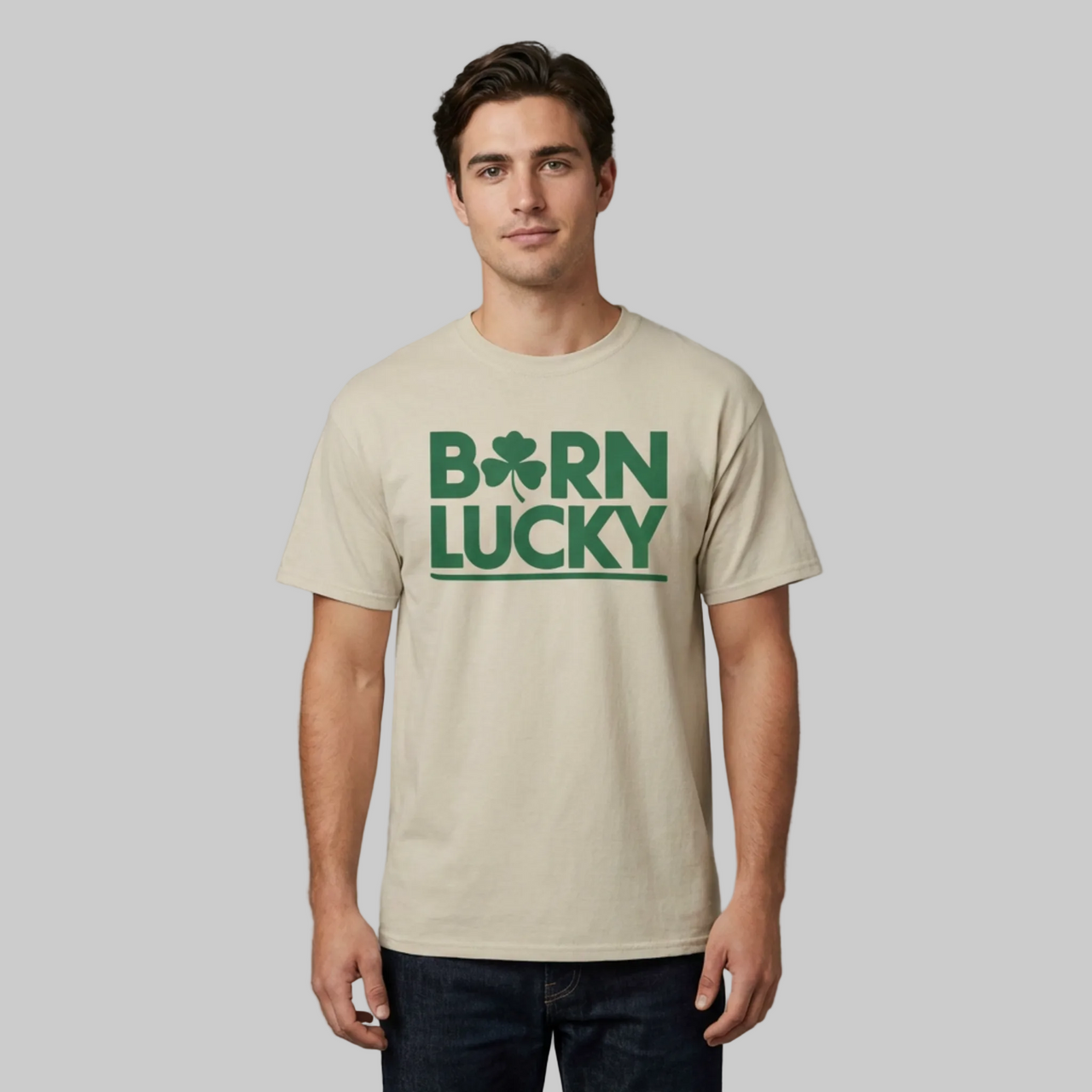 Man wearing a beige t-shirt with 'Born Lucky' text and clover funny st patricks day design