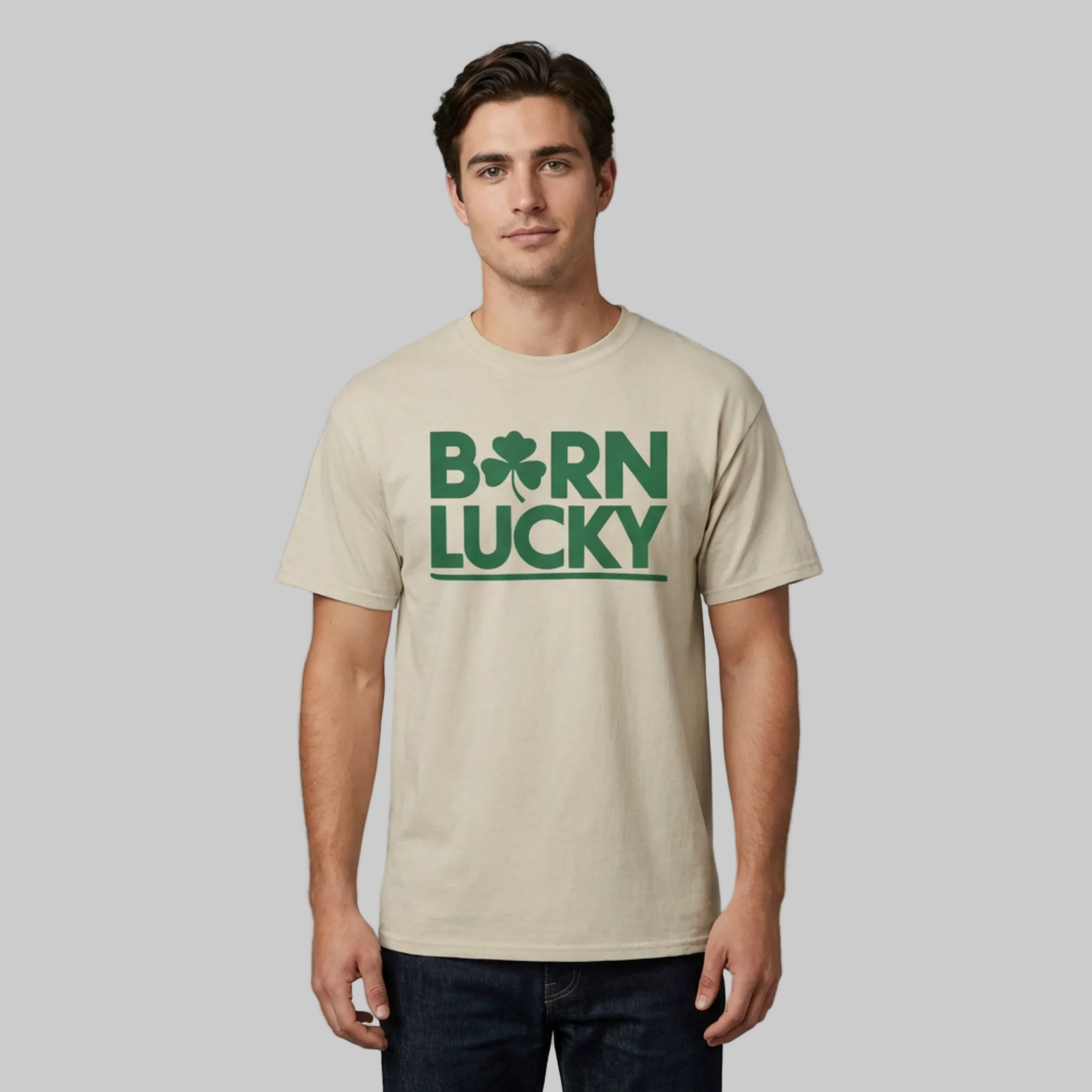 Man wearing a beige t-shirt with 'Born Lucky' text and clover funny st patricks day design