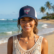 Woman wearing a navy and white trucker hat with 'Certified Beach Flirt' text funny spring break, girls trip beach trip, bachelorette party design