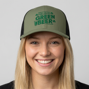 woman wearing a green and black curved trucker hat with the phrase 'Fueled by Green Beer' funny St Patricks Day pub crawl design
