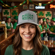 woman wearing a gray and black curved trucker hat with the phrase 'Fueled by Irish Whiskey' funny St Patricks Day Pub crawl and parade design