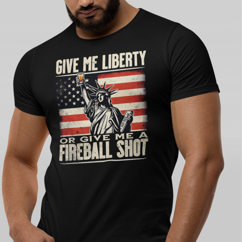 T-shirt with 'Give Me Liberty or Give Me a Fireball Shot' text, Statue of Liberty holding a shot glass, and distressed American flag background.