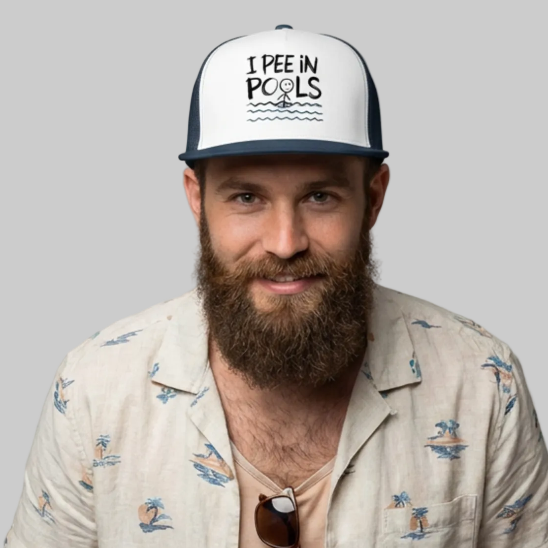 Man wearing a navy and white flat bill trucker hat with the phrase "I pee in Pools" funny spring break, girls trip, guys trip, beach rip design