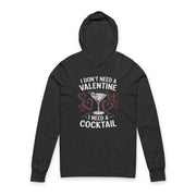 black featherweight hoodie with the phrase “I don’t need a valentine I need a cocktail” with an ink sketched wine glass and sketched valentine hearts to  complete the design