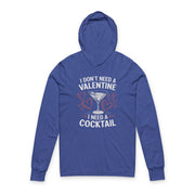 royal blue featherweight hoodie with the phrase “I don’t need a valentine I need a cocktail” with an ink sketched wine glass and sketched valentine hearts to  complete the design