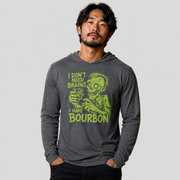 A man wearing a dark gray long-sleeve hoodie with a lime green zombie graphic and the text 'I DON'T NEED BRAINS I HAVE BOURBON' on the front, set against a solid light gray background.