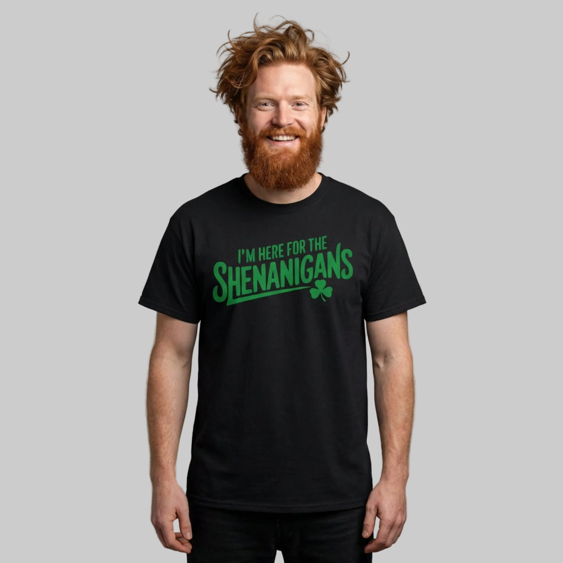 Man wearing a black t-shirt with the phrase "I'm here for the shenanigans" funny st patricks day design