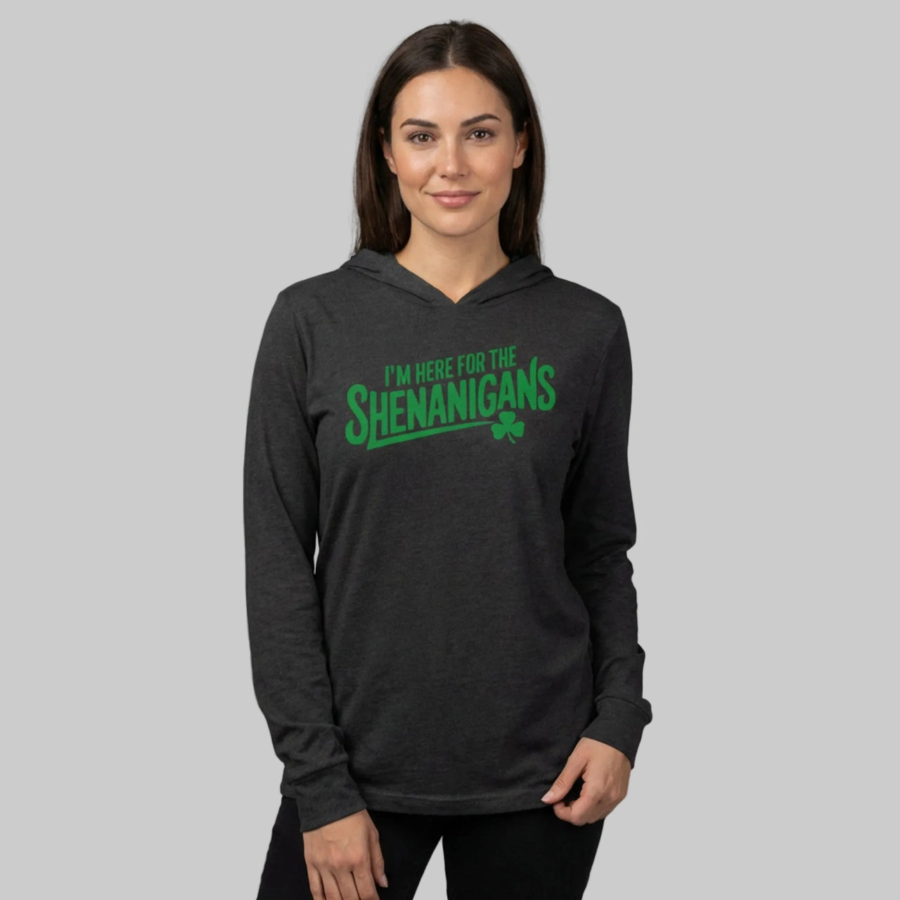 woman wearing a black hoodie with the phrase "i'm here for the shenanigans" funny st patricks day design