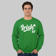 Man wearing a green sweatshirt with 'Irish AF' text funny St Patricks day design