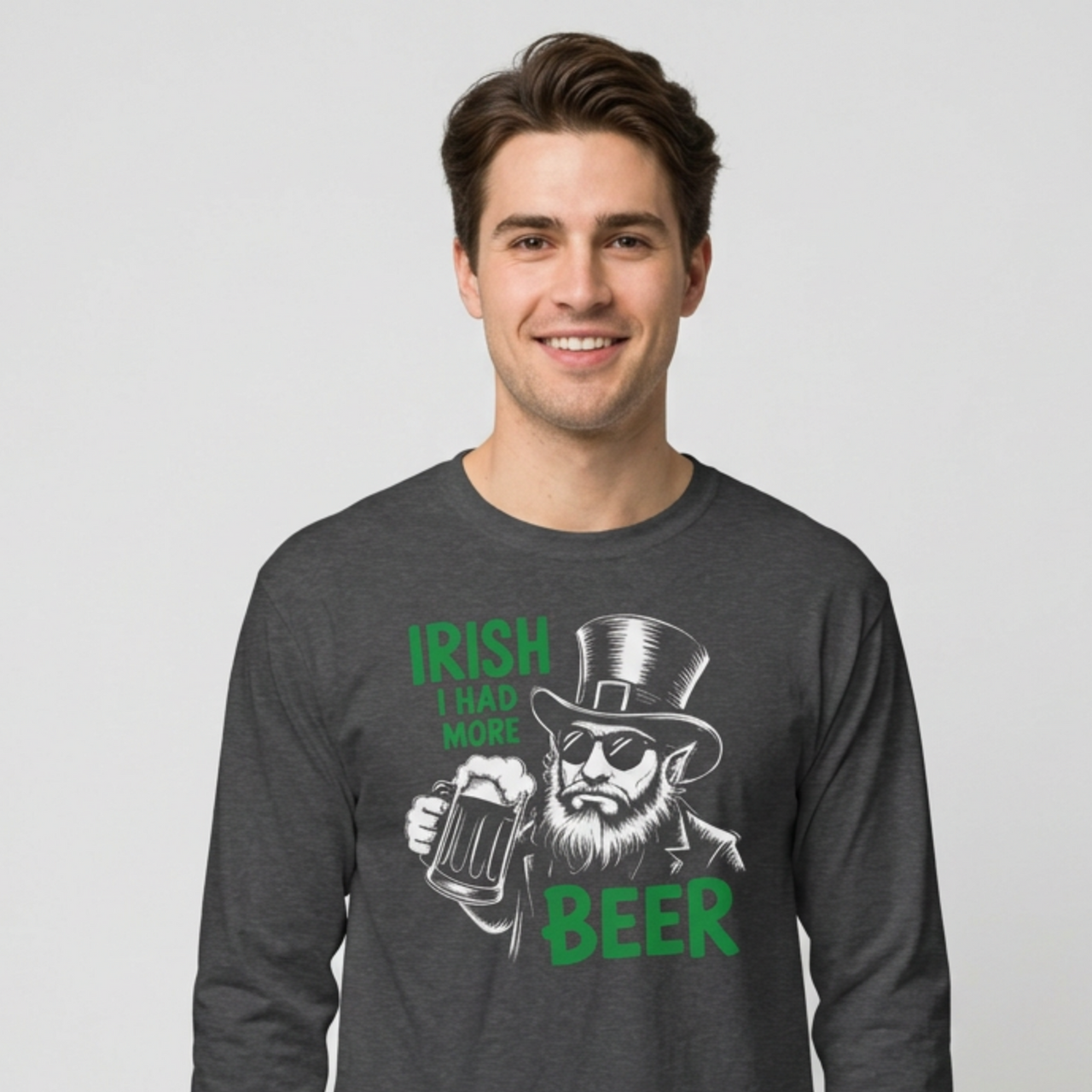 Man wearing a dark gray long sleeve tee with leprechaun graphic and text 'Irish I had more beer' funny St Patricks pub crawl and parade design