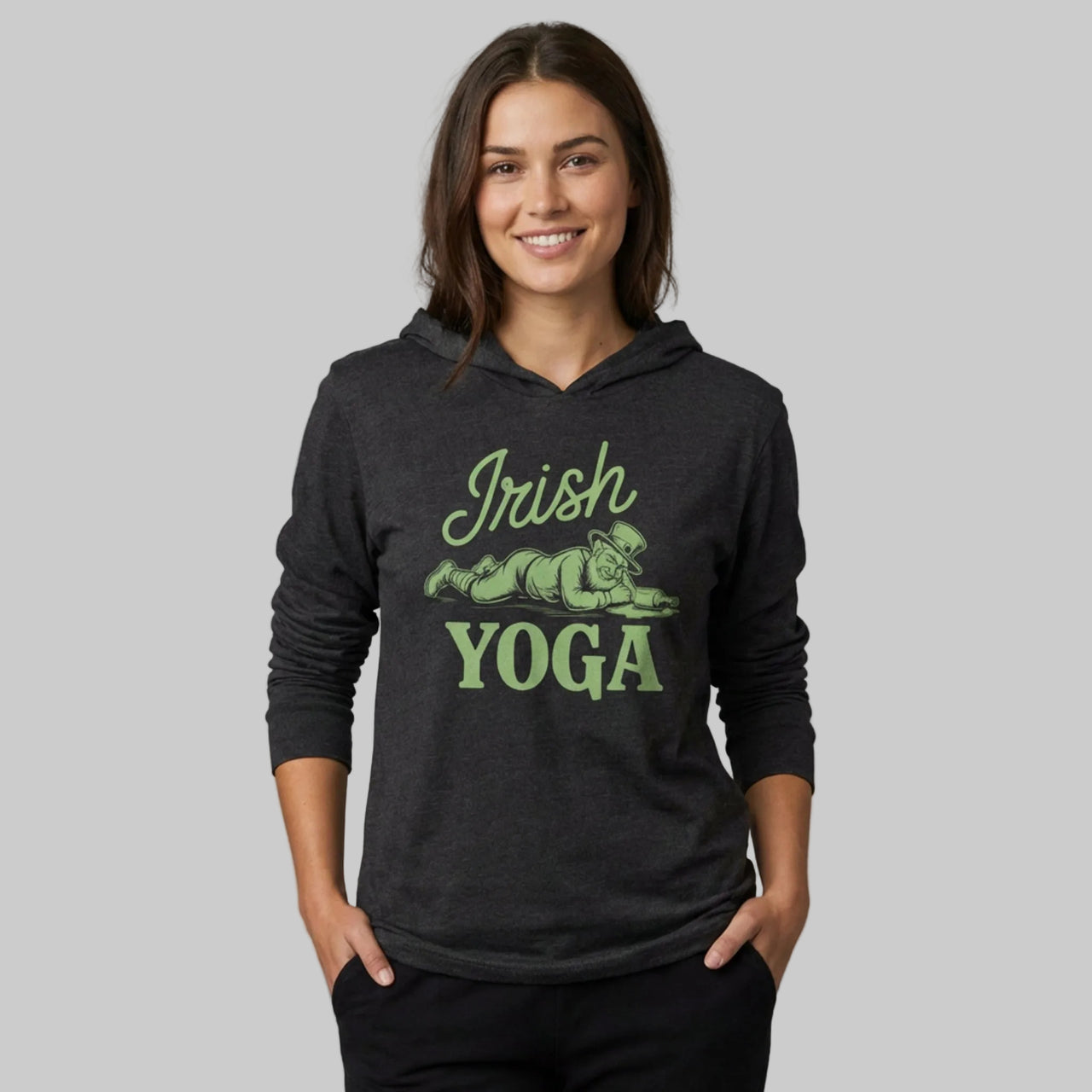 Woman wearing a black hoodie with 'Irish Yoga' text and graphic on a gray background