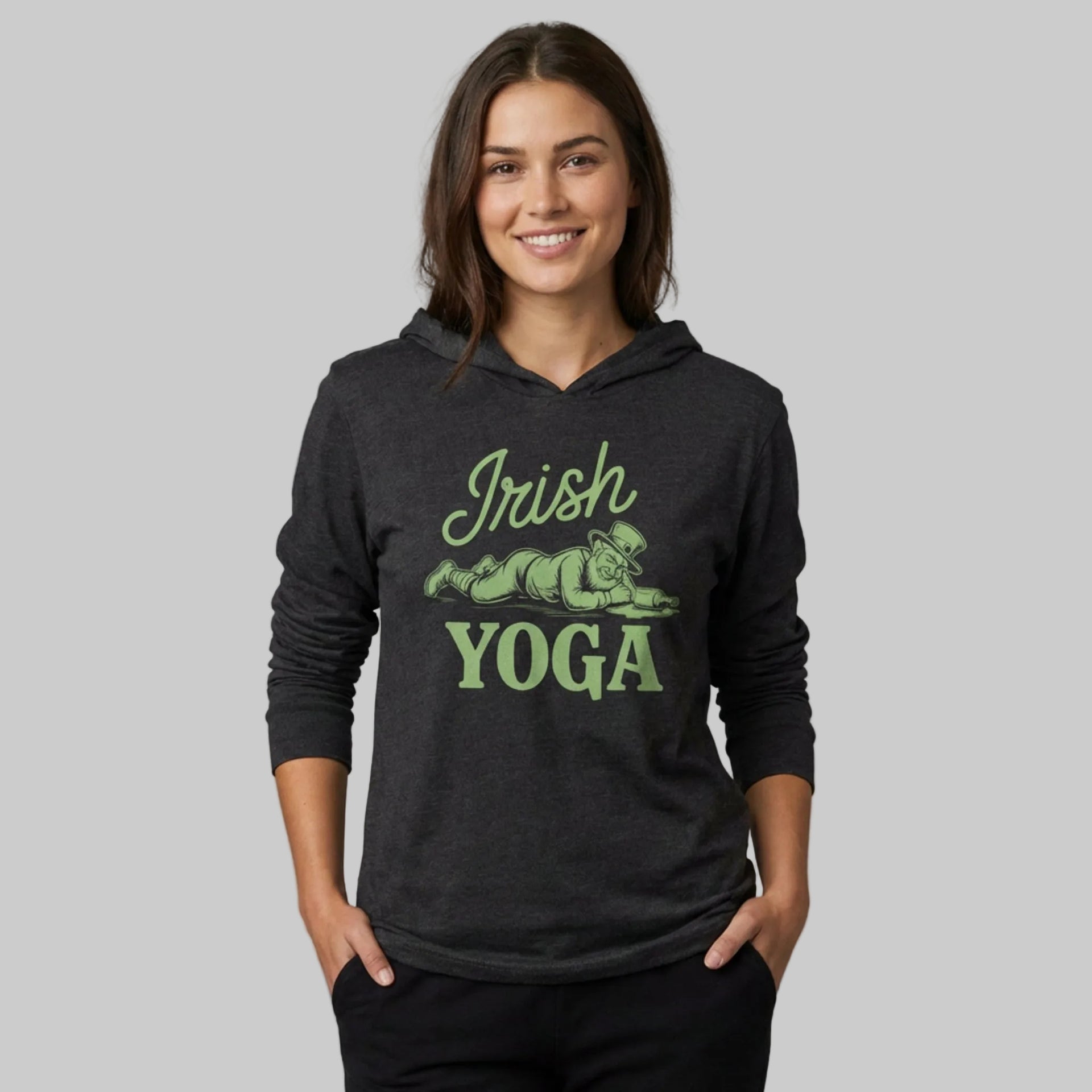 Woman wearing a black hoodie with 'Irish Yoga' text and graphic on a gray background