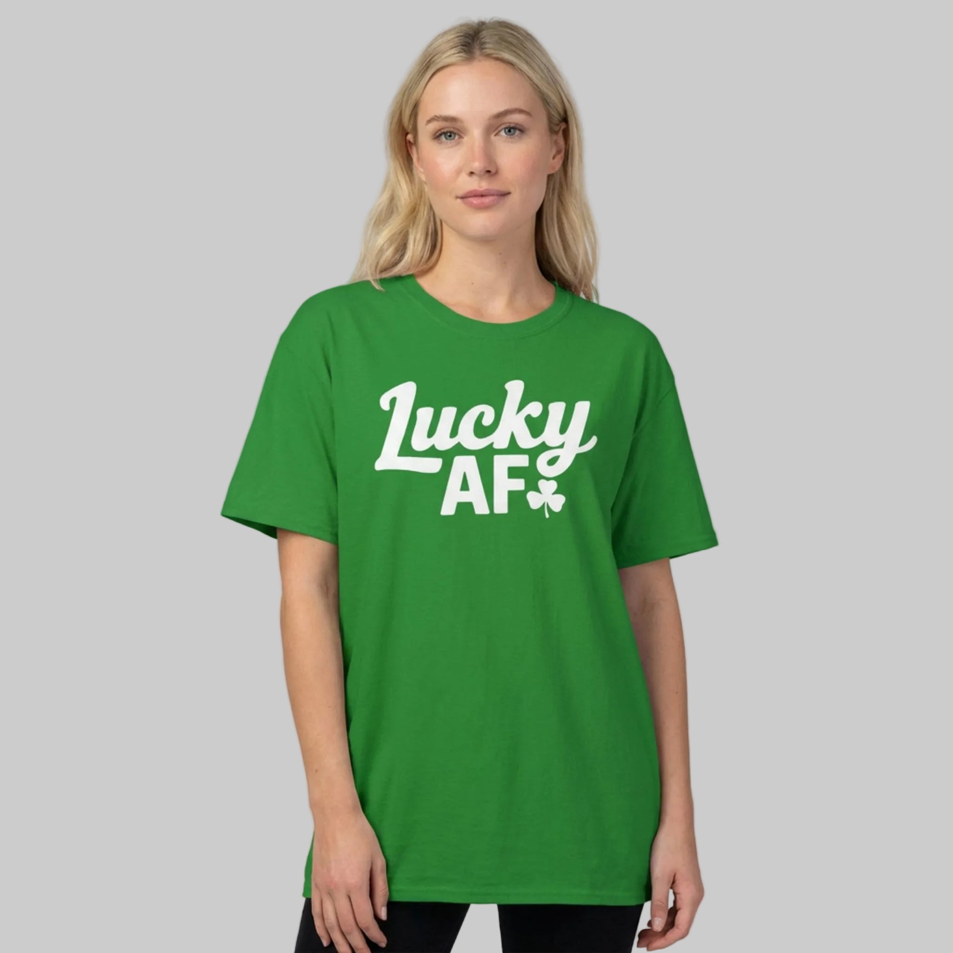 Woman wearing a Green t-shirt with the phrase 'Lucky AF' funny st patricks day design