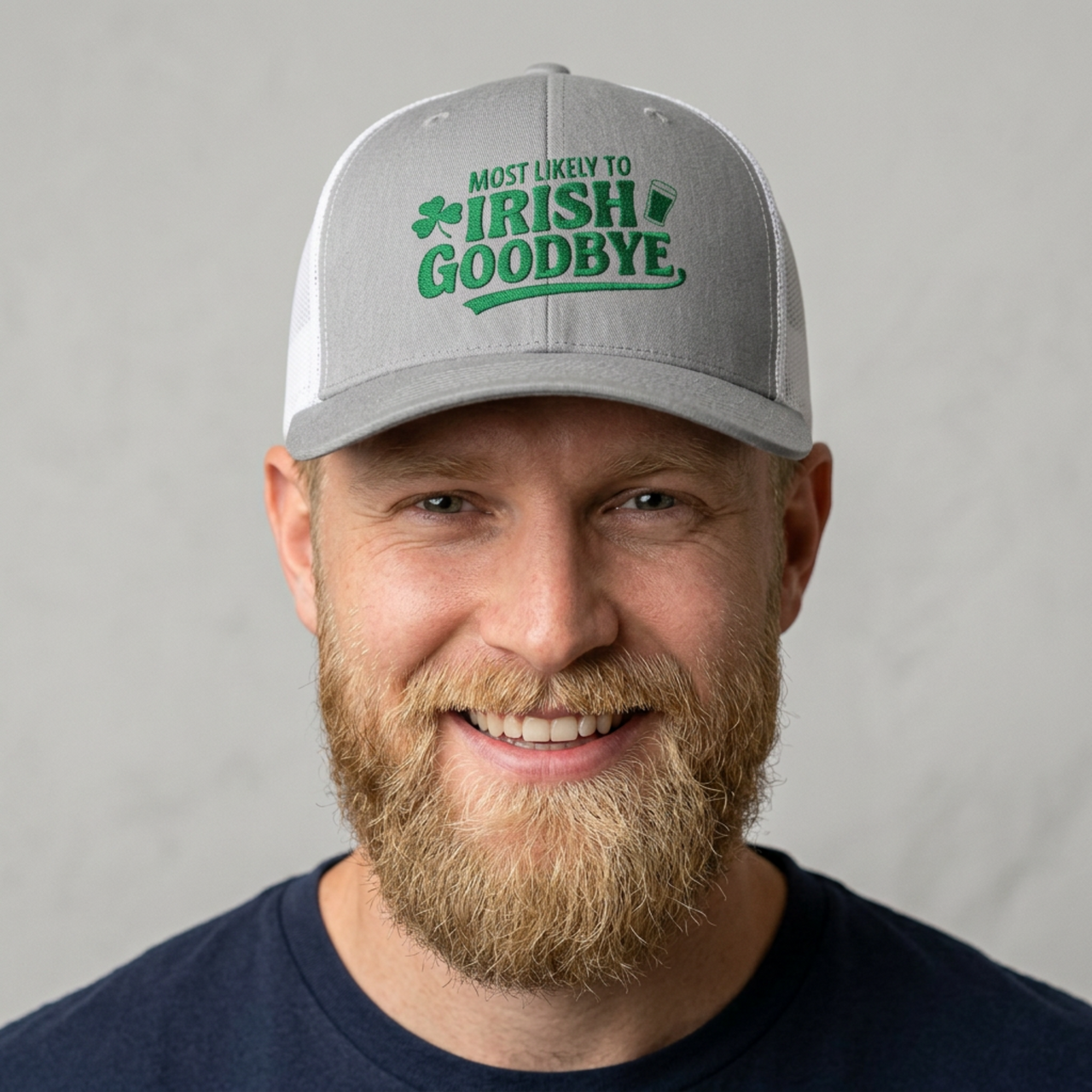 Man wearing a gray and white curved bill trucker hat with 'Most Likely to Irish Goodbye' text funny st patricks day pub crawl design