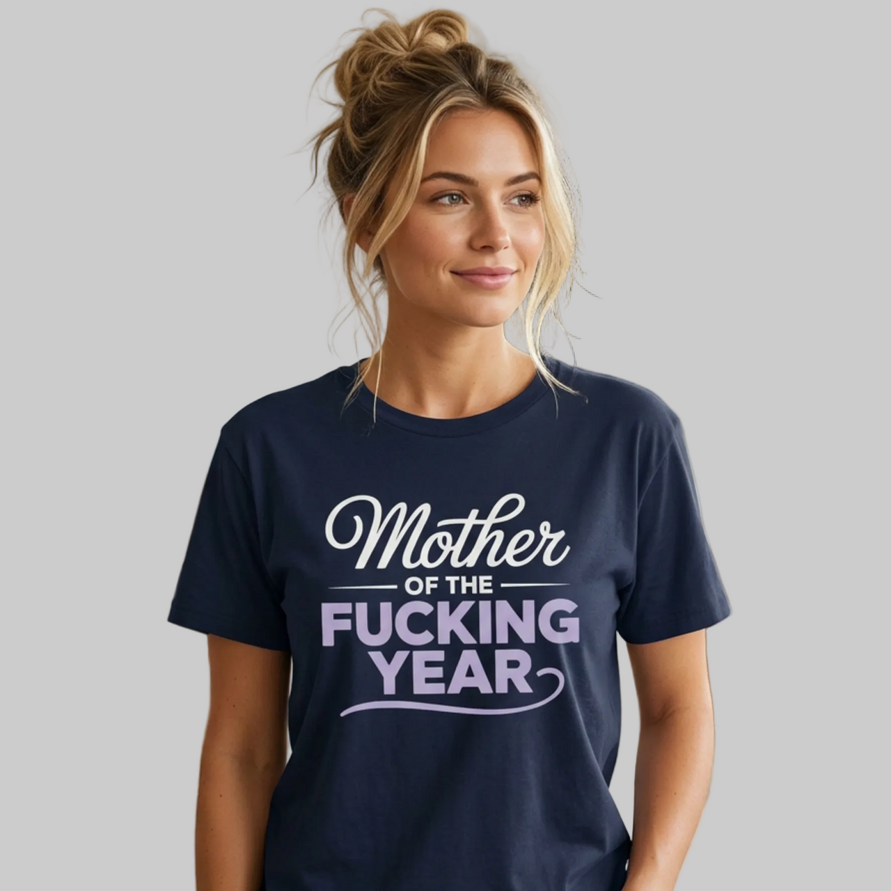 Woman wearing a navy blue premium soft-style t-shirt with the phrase mother of the f-ing year funny mother's day, mom life design