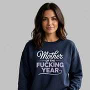 Woman wearing a navy blue sweatshirt with the text 'Mother of the F'ing Year' funny mother's day, girls trip, mom life design