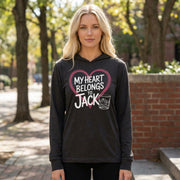 blonde woman wearing a black featherweight valentine's day hoodie with the Phrase “my heart belongs to jack” surrounded by a  sketched valentines heart and a bourbon glass
