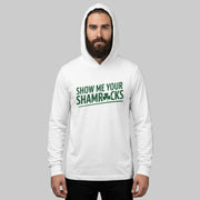 Man wearing a white hoodie with 'Show Me Your Shamrocks' text on a gray background