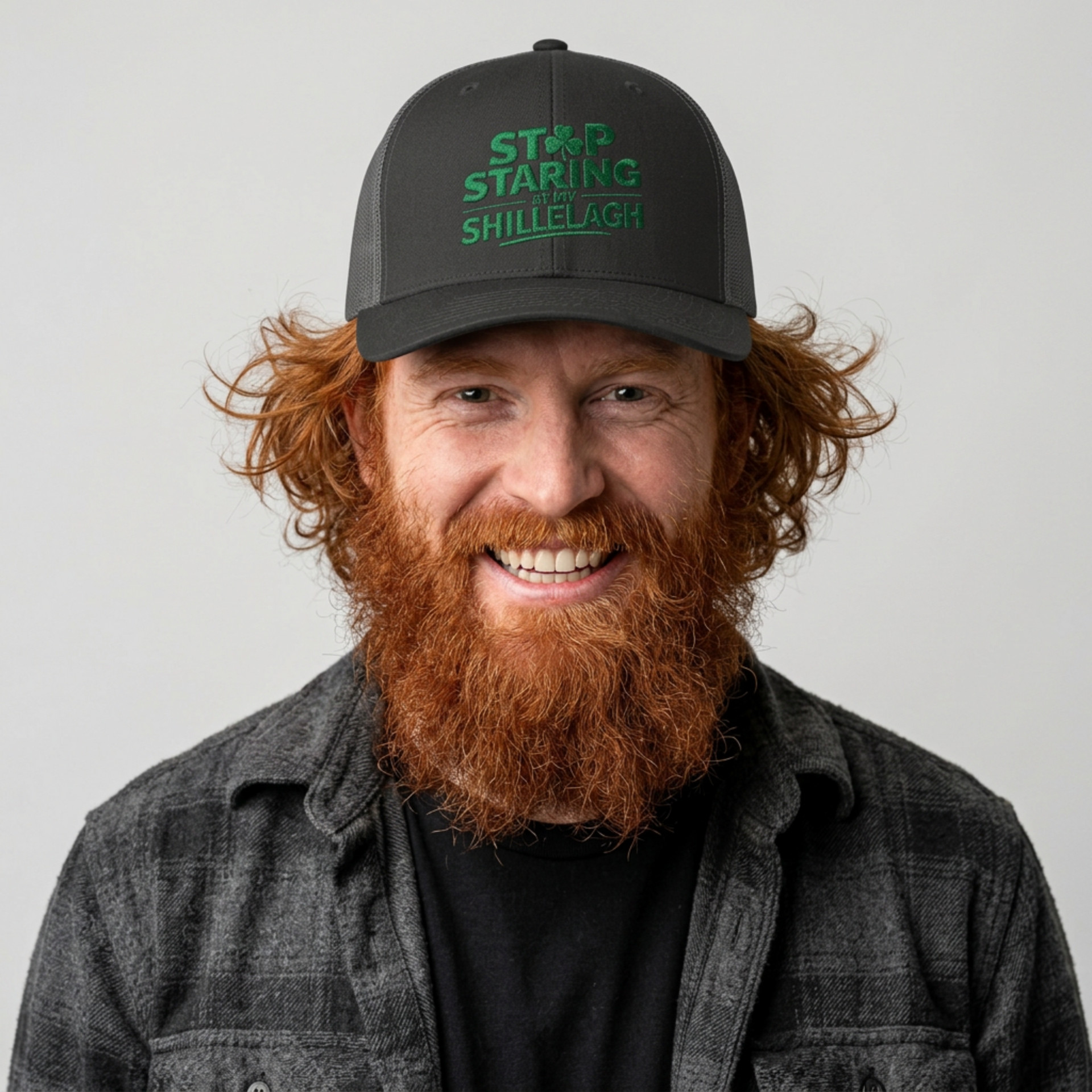 Man wearing a black and gray curved trucker hat with the phrase "Stop Staring at my Shillelagh" funny St Patricks Day pub crawl or parade design