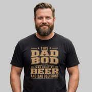 Man wearing a black t-shirt with the phrase "THis Dad Bod was Built on Beer and Bad decisions" funny father's day design