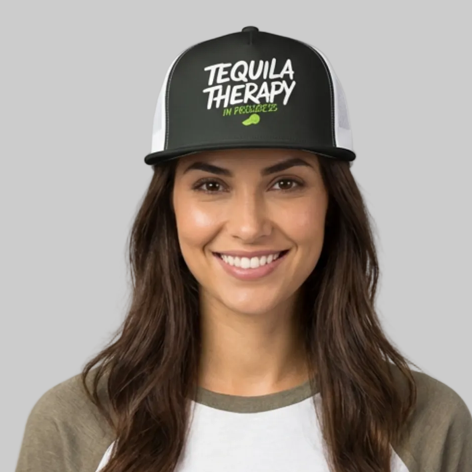 Woman wearing a charcoal and white flat bill trucker hat with the phrase "Tequila Therapy in Progress" funny spring break, girls trip, cinco de mayo design