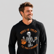 A man wearing a black long-sleeve hoodie with a Halloween graphic of a skeleton holding an orange jack-o'-lantern and a glass of amber liquor, with the text 'TRICK OR TREAT I'LL TAKE A BOURBON' in orange, against a solid gray background.