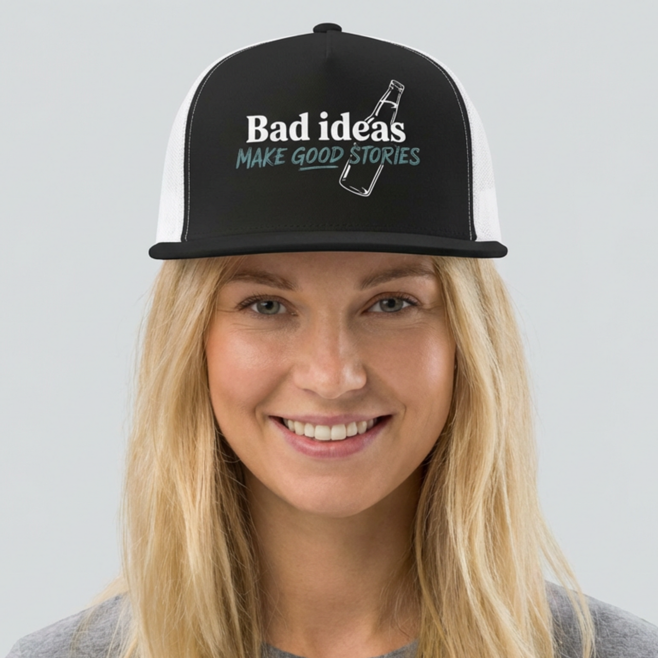 woman wearing a black and white flat bill trucker hat with the phrase "Bad ideas make good stories" funny spring break, guys trip, girls trip, bachelor, or bachelorette party design