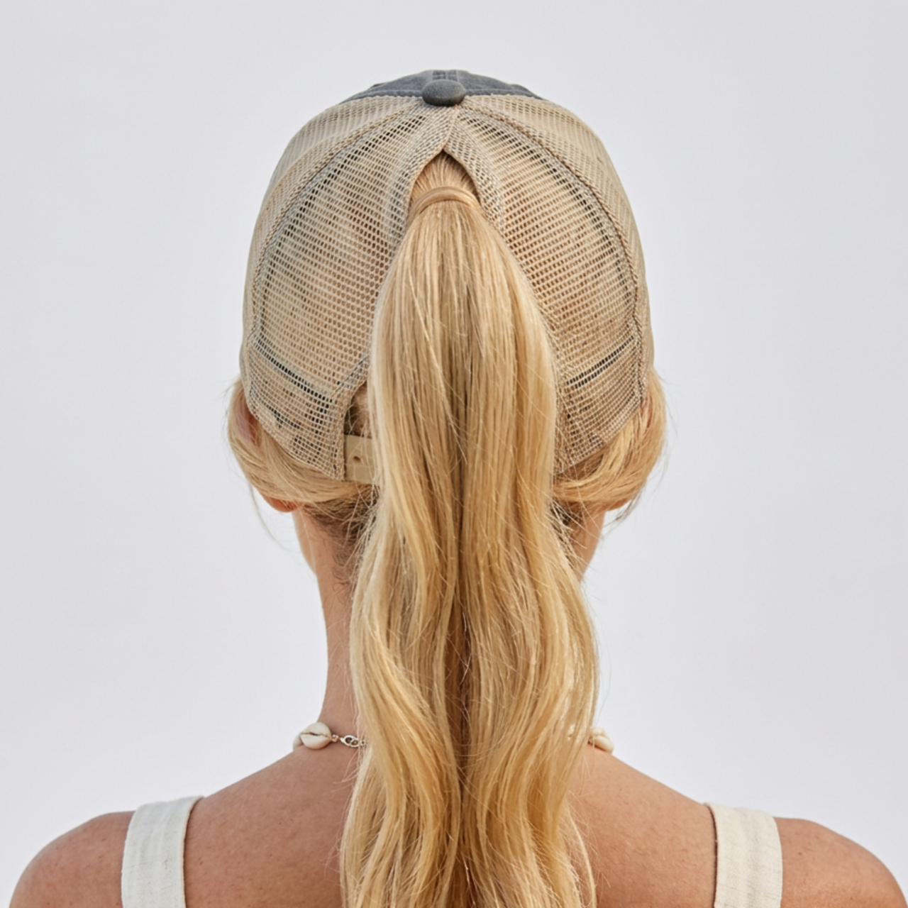 Back view of a Woman wearing a balck and khaki faded ponytail trucker cap with 'Cougar on the Loose' text and lipstick kiss mark funny spring break, beach vacation, summer vacation, lake season design.
