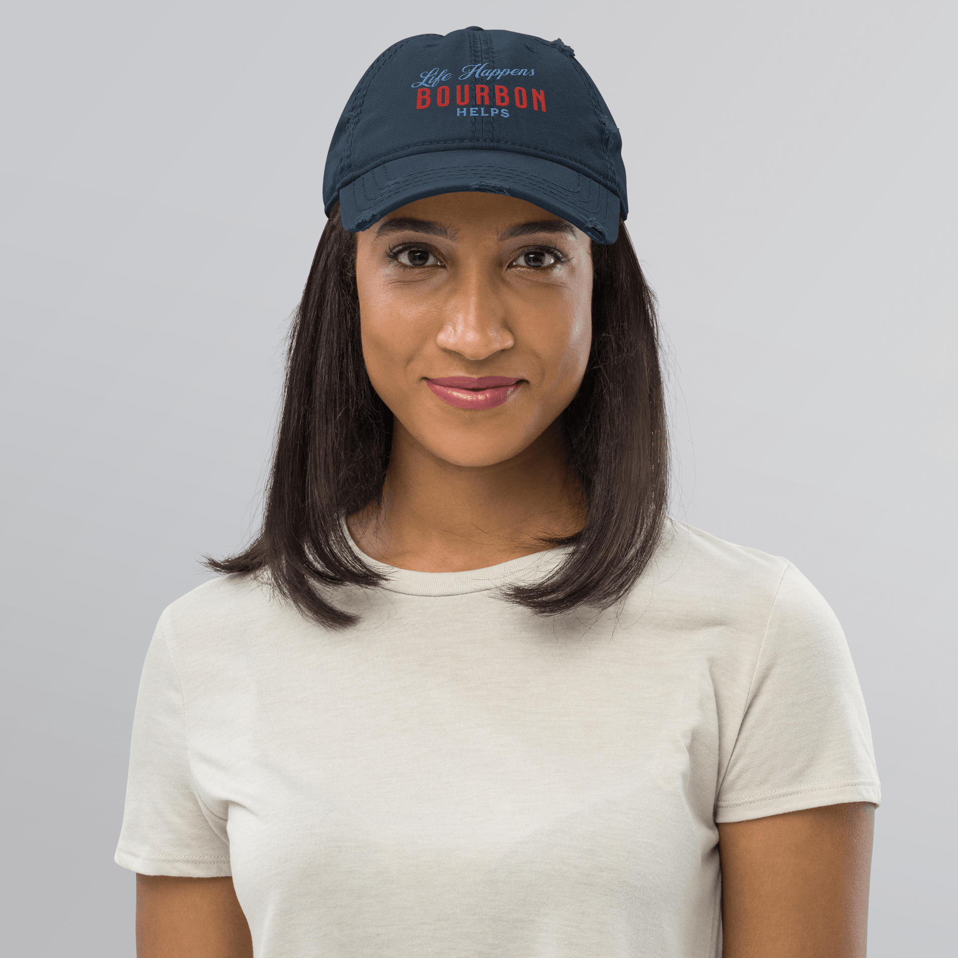 "Life Happens Bourbon Helps" Dad Hat | Fun & Edgy CapAdd flair with our "Life Happens Bourbon Helps" Dad Hat. Perfect for drinking enthusiasts. Distressed style, 100% cotton for comfort & style.