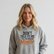 Woman wearing a gray hoodie with text 'Don't talk to me I've had my Mimosa' funny mother's day, mom life, girls trip design