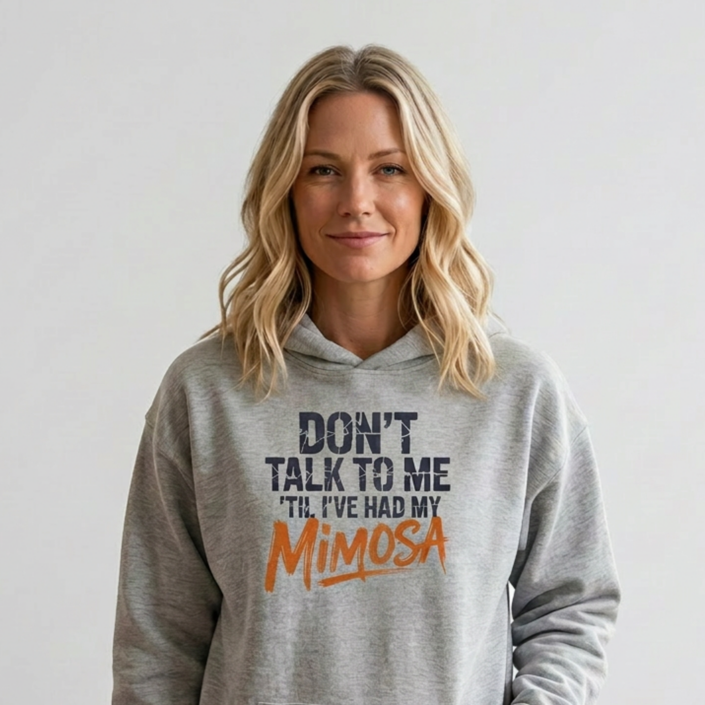 Woman wearing a gray hoodie with text 'Don't talk to me I've had my Mimosa' funny mother's day, mom life, girls trip design