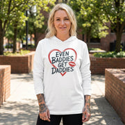 blonde female model wearing white featherweight hoodie with the phrase "Even Baddies Get Daddies" with a minimalist sketched valentine's heart surrounding the phrase to complete the design
