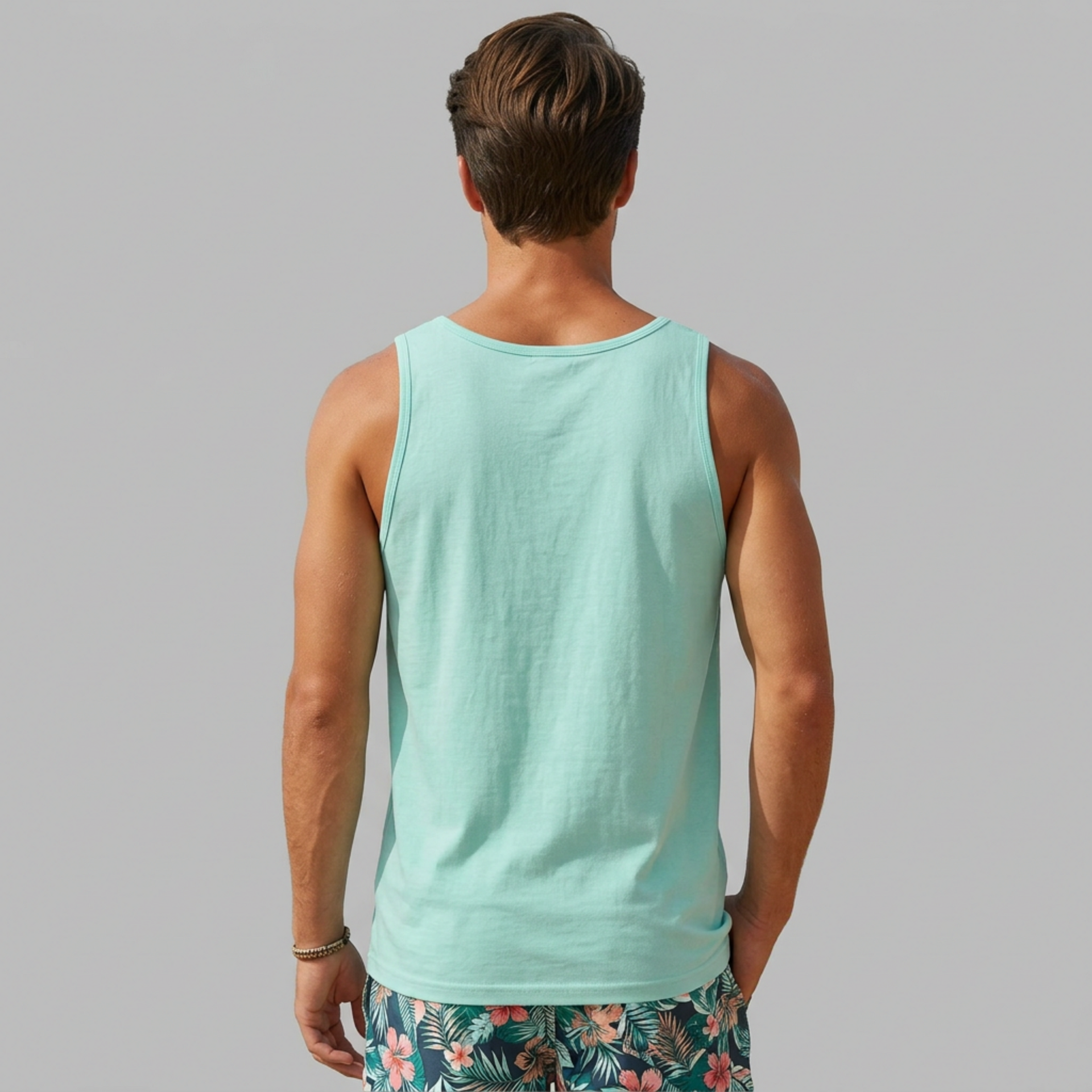 Man wearing a light blue tank top with the phrase if found return to the beach funny spring break, girls trip, guys trip, beach trip, summer vacation, and bachelor bachelorette party design