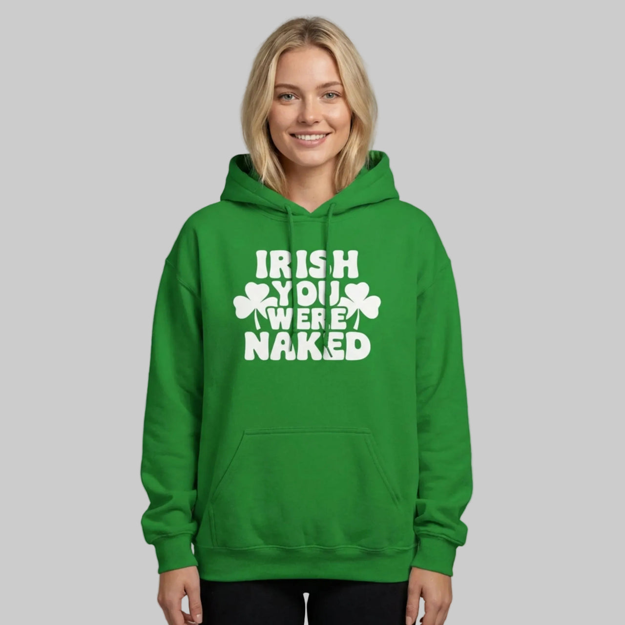 Person wearing a green hoodie with the phrase i wish you were naked and shamrock design