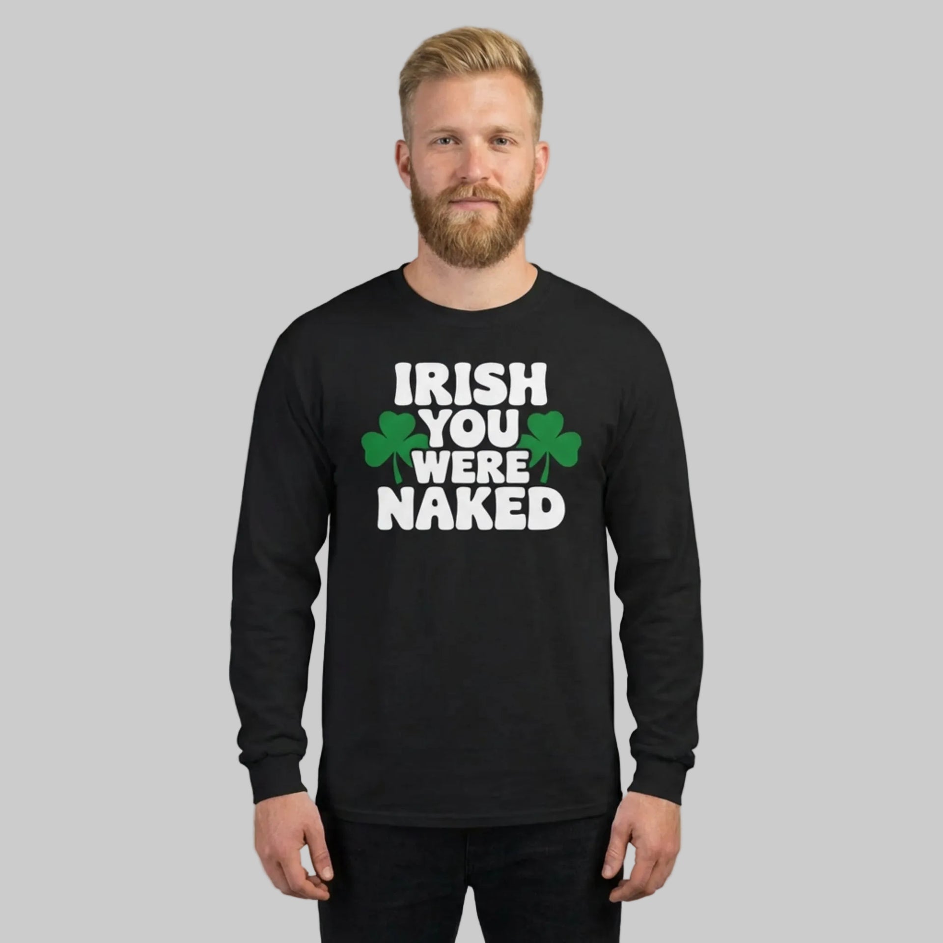 Man wearing a black long-sleeve shirt with 'Irish You Were Naked' text and shamrock graphics on a gray background