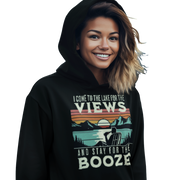 Hoodie featuring "I Come to the Lake for the Views and Stay for the Booze," with a man in a beach chair by the lake and a retro sunset.