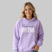 Woman wearing a purple hoodie with 'Mama needs a DRINK' text funny mothers day mom life design