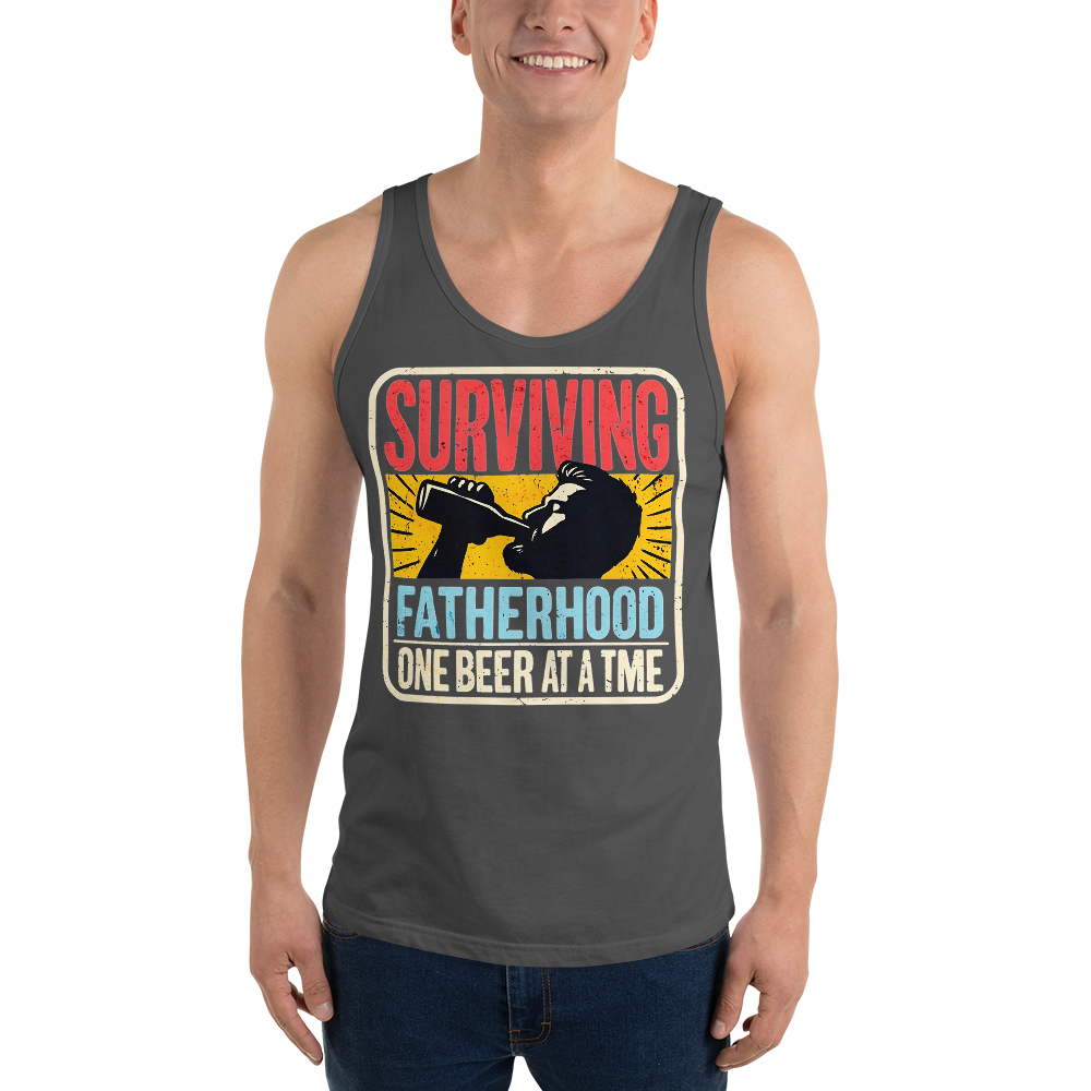 Celebrate fatherhood with our "Surviving Fatherhood One Beer at a Time" tank top. Perfect gift for dads who love a cold one. Ideal gift for Father's Day.