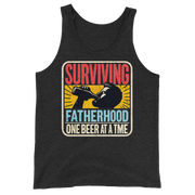 Celebrate fatherhood with our "Surviving Fatherhood One Beer at a Time" tank top. Perfect gift for dads who love a cold one. Ideal gift for Father's Day.