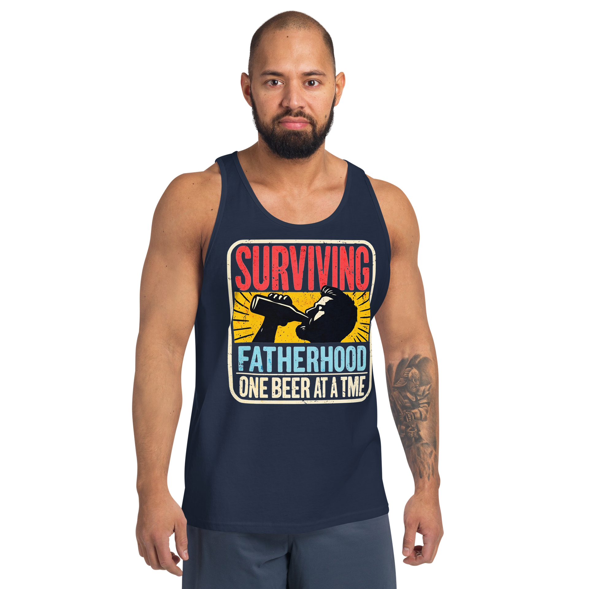 Celebrate fatherhood with our "Surviving Fatherhood One Beer at a Time" tank top. Perfect gift for dads who love a cold one. Ideal gift for Father's Day.