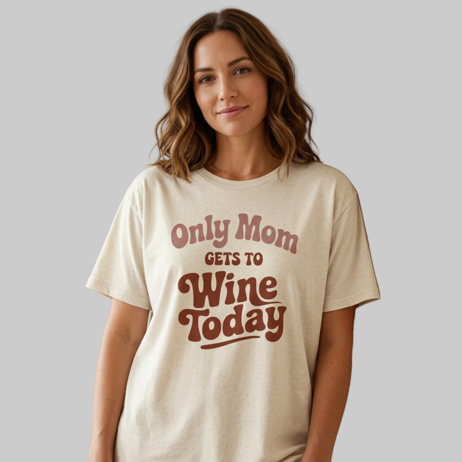 Woman wearing a beige t-shirt with 'Only Mom Gets to Wine Today' text funny mother's day, mom life, spring break, beach trips design
