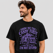 A man wearing a black crewneck t-shirt with a purple graphic of a retro van and the text 'SHOW ME THE CANDY FIRST THEN WE'LL TALK I'M NOT STUPID'.