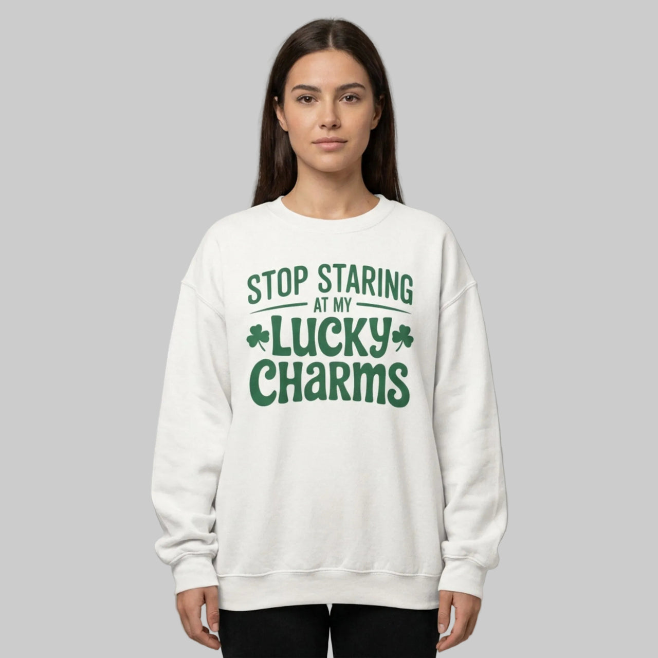 Woman wearing a White sweatshirt with green text 'Stop Staring at My Lucky Charms' funny St Patricks Design