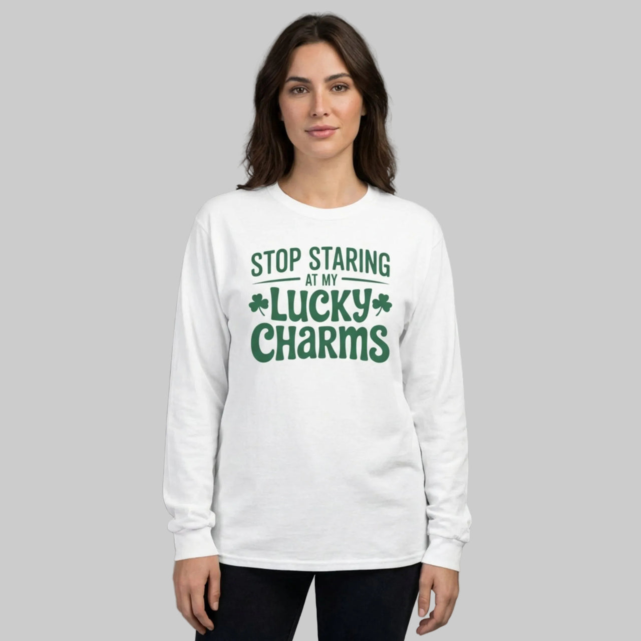 Woman wearing a white long-sleeve shirt with the phrase stop staring at my lucky charms funny st patricks day design
