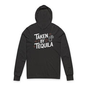 black featherweight hoodie with the phrase "Taken By Tequila" with a sketched valentine's hearts and a shot glass with a lime surrounding the phrase to complete the design
