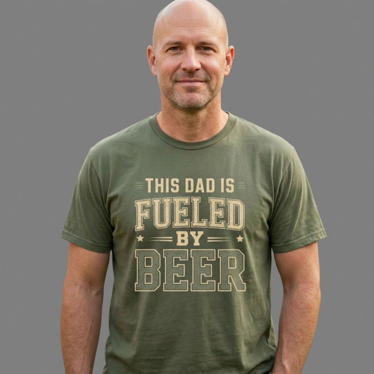 Man wearing a green t-shirt with 'This Dad is Fueled by Beer' text funny father's day gift