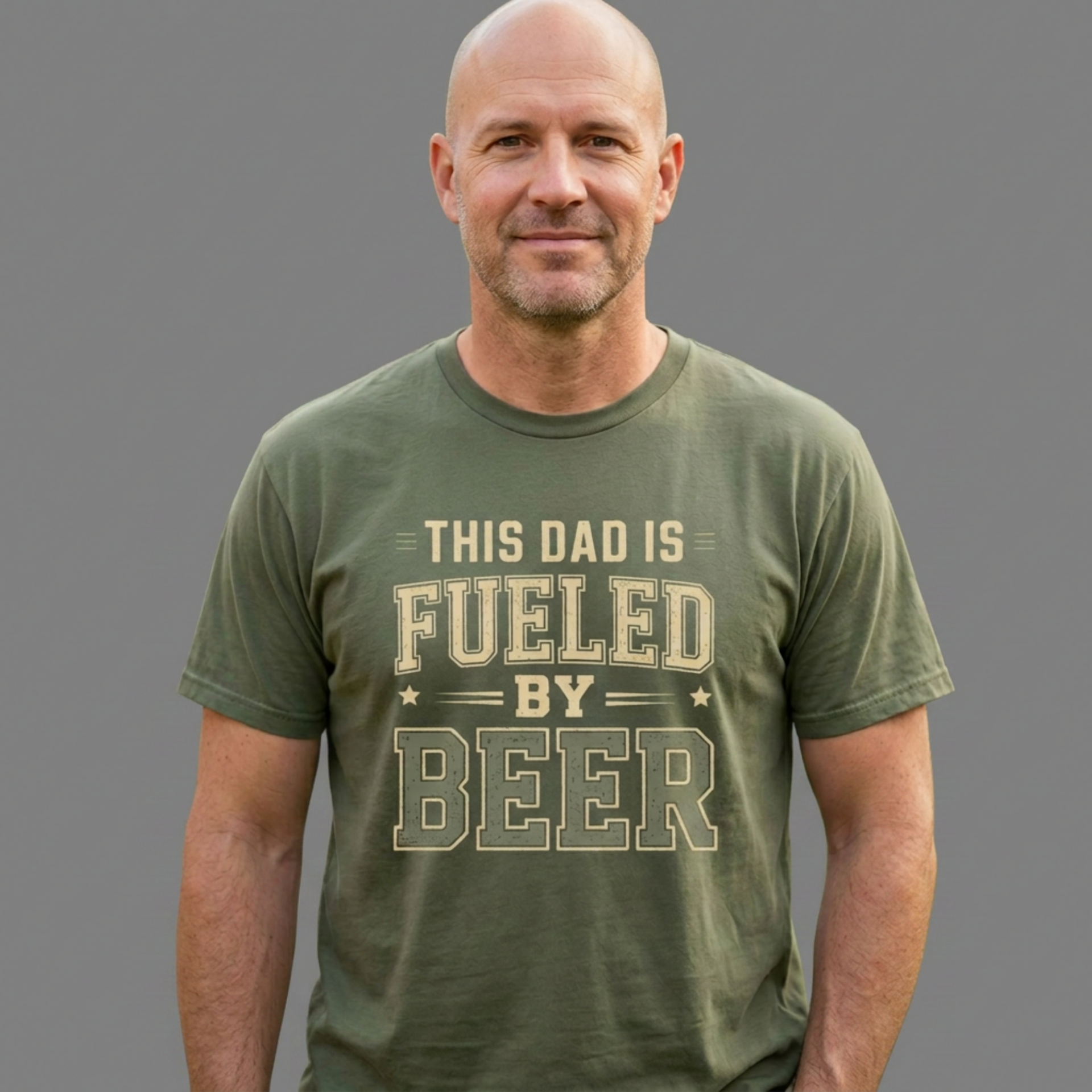 Man wearing a green t-shirt with 'This Dad is Fueled by Beer' text funny father's day gift